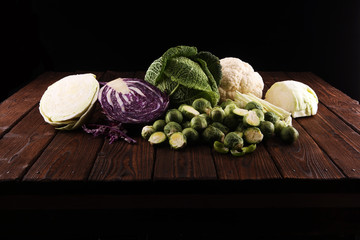 Wall Mural - organic cabbage heads. Antioxidant balanced diet eating with red cabbage, white cabbage and savoy. cauliflower