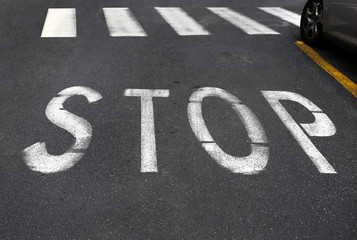 City crosswalk with symbol stop