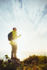 Portrait of a man standing on top of a hill