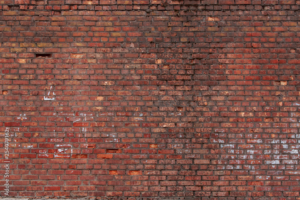 Old brick wall with scratches, cracks, dust, crevices, roughness. Can be used as a poster or background for design. - obrazy, fototapety, plakaty 