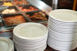 stacking plates in the buffet restaurant 