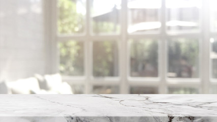 Empty white marble stone table top on blurred with bokeh cafe and restaurent interior background - can be used for display or montage your products