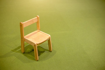 Wall Mural - kids wood chair object on green carpet