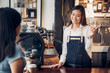 © weedezign - woman barista talking with customer about tasted of coffee cup with happy emotion at counter bar at cafe.coffee shop business owner concept,Service mind waiter