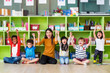 © weedezign - Happy Asian female teacher and mixed race kids in classroom,Kindergarten pre school concept.