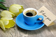 bouquet and a cup of coffee. tulips and a cup of coffee. coffee and a note i love you. inscription i love you