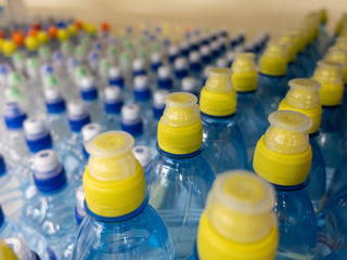 Wall Mural - Lid plastic water bottle in the market. multi-colored plastic bottle caps	