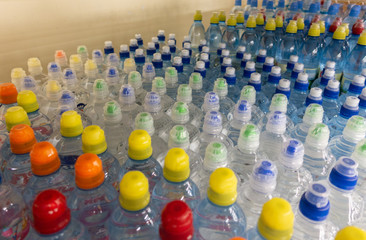 Wall Mural - Lid plastic water bottle in the market. multi-colored plastic bottle caps	