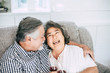 © Johnstocker - Happy Elderly woman and her husband drinking wine and happiness