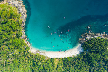 Poster - View from above, stunning aerial view of a beautiful tropical beach with white sand and turquoise clear water, long-tail boats and people sunbathing, Freedom beach, Phuket, Thailand.
