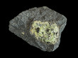 Green peridote (olivine) in dark basalt rock