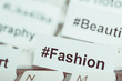 © gesrey - Popular hashtag 'fashion' printed on paper and on the keyboard. Close up. Toned.
