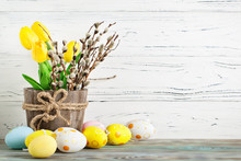 Happy Easter. Congratulatory Easter Background. Easter Eggs And Flowers. Background With Copy Space. Selective Focus. Top View.
