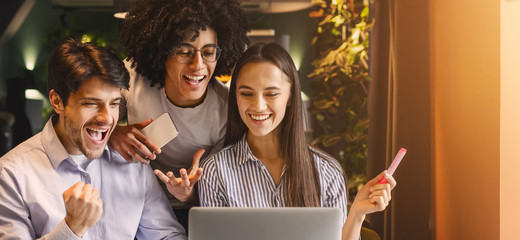 Poster - Successful business team looking at laptop happily
