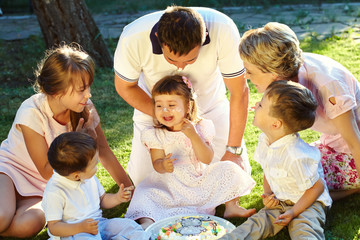 Wall Mural - playful family outdoors. parents with children in the summer. Mom, dad and kids