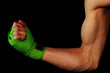 © pangamedia - Male showing biceps with boxing straps