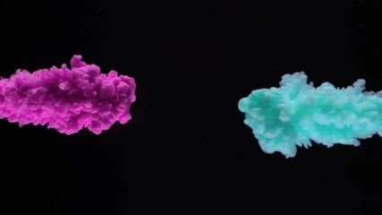 Sticker - Super slow motion of coloured inks in water. Isolated on black background. Filmed on high speed cinema camera.