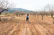 © satura_ - Travel, summer and people concept - woman with stylish backpack on nature background. She is on holiday