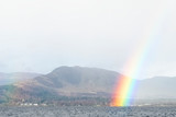 Fototapeta Tęcza - Rainbow at Loch Lomond during rain and wet weather calm before the storm