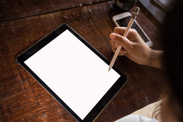 Business women hand use tablet computer close up on white screen in cafe