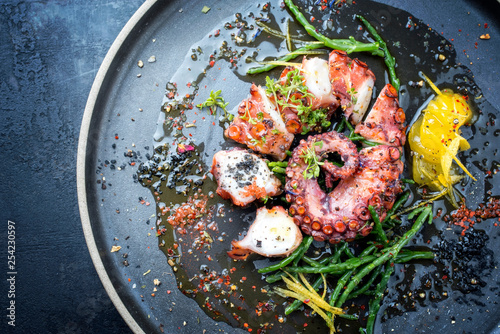 Fotomural Traditional French octopus braised cooked with Salicornia, lemon curd and spice