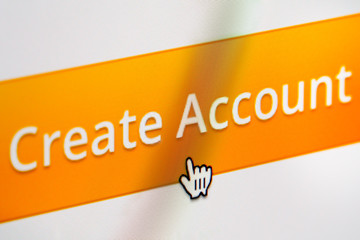 Wall Mural - Create account button of a website being clicked. Close up of a computer screen.