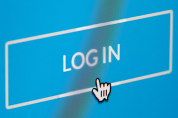 Wall Mural - Login button of a membership website being clicked. Close up of a computer screen.