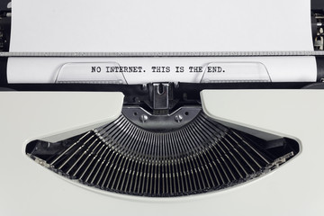 Fototapete - Old retro obsolete white typewriter with close-up typing text No Internet This is the End as heading on paper