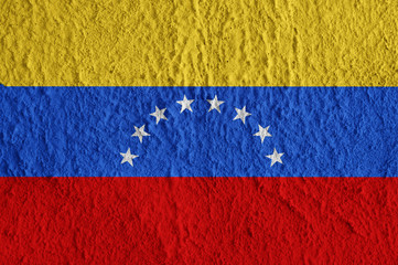 Venezuela flag on concrete surface. Creative wallpaper for installation and design.