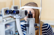 a young woman examines the eyes of an ophthalmologist on a slit lamp, slit lamp sharpness