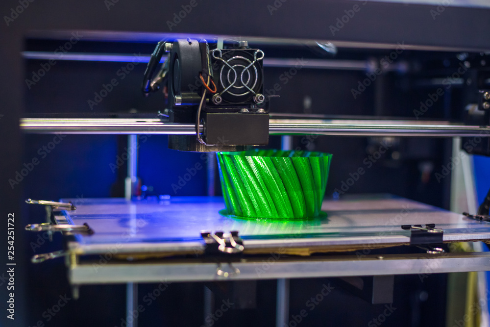 Three dimensional printing machine printing 3D plastic model at modern ...