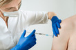 Vaccination. An injection into the arm.