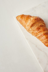 Croissants on the white marble board