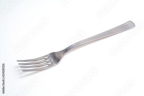 Photographie steel fork isolated on white background