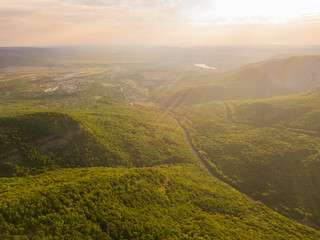 Wall Mural - bright summer sunshine in the high mountains covered with forest b