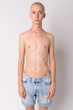 Portrait of young handsome androgynous man shirtless