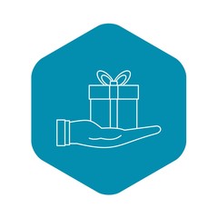 Wall Mural - Gift box in hand icon. Outline illustration of gift box in hand vector icon for web design