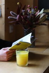 yellow book and tea with flowers 