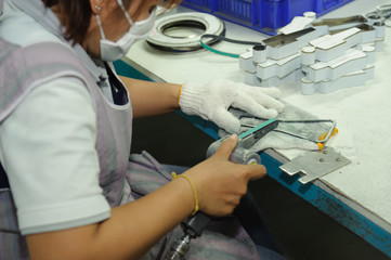 Worker using handy air belt sander