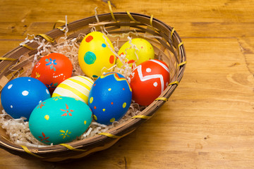 easter eggs on wooden background, top view