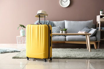 Packed suitcase in room. Travel concept