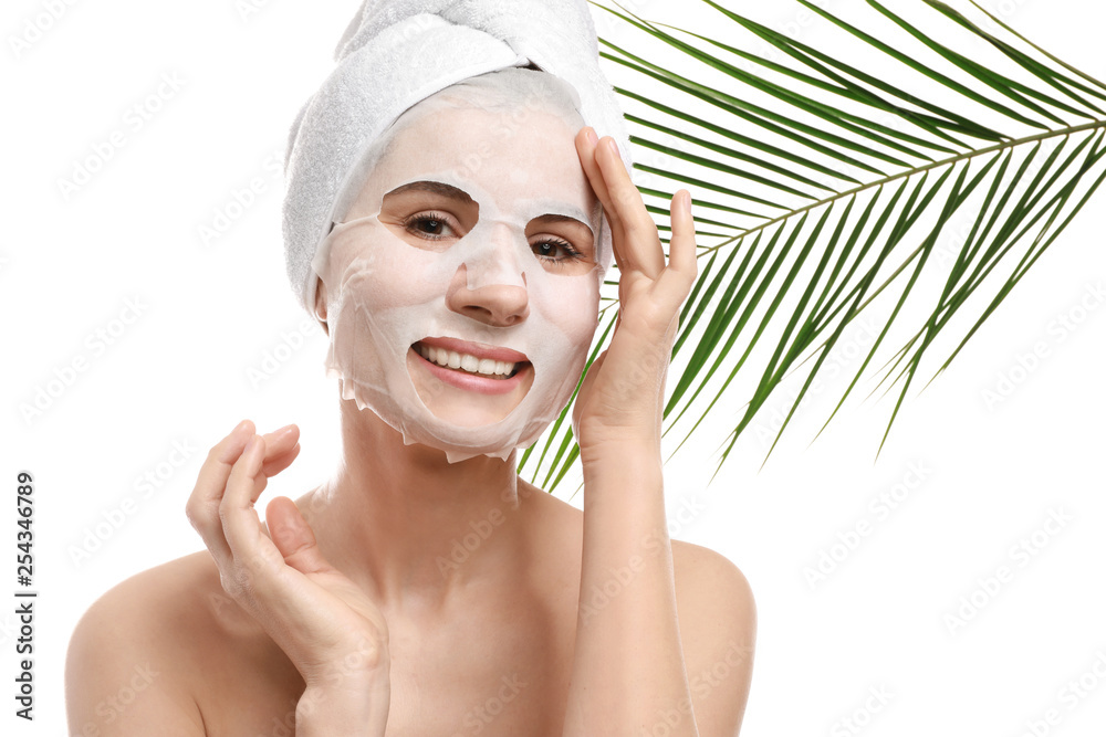 Woman with sheet facial mask on white background