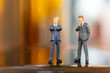 © Sirichai Puangsuwan - Miniature people : Businessman  standing and thinking with colorfull background