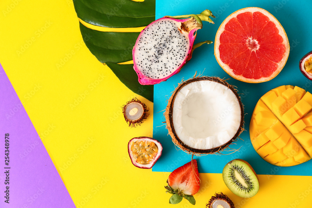 Assortment of exotic fruits on color background