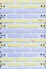 Wall Mural - white brick wall painted with soft purple and yellow background texture.