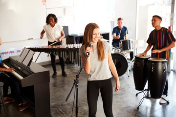 Wall Mural - Students At Performing Arts School Playing In Band At Rehearsal