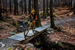 © Gorilla - Mountain biking woman riding on bike in summer mountains forest landscape. Woman cycling MTB flow trail track. Outdoor sport activity.