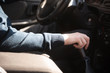© bo.kvk - A man switches the speed on the gearbox in the car