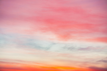 Wall Mural - sunset sky with pink orange light clouds. colorful smooth blue sky gradient. natural background of s
