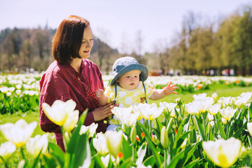 Mother and baby girl in spring park